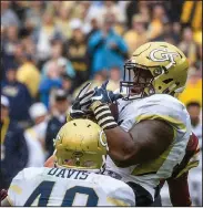  ?? AP PHOTO ?? In this photo released by Georgia Tech, Georgia Tech defensive tackle Kyle Cerge-Henderson grabs a fumble during the first half of the game against Boston College, Saturday in Dublin, Ireland.