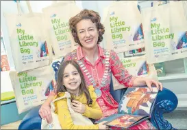  ?? (Pic: Brian Lougheed) ?? Cork County Council Library Service is inviting all children starting school in September 2022 to collect a free ‘My Little Library Book Bag’ at their local branch or mobile library from April 19th to help them to prepare for this big step. Pictured are the Mayor of the County of Cork, Cllr. Gillian Coughlan and four-year-old Alexandra Walsh-McLoughlin at the recently opened Bandon Library.