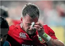  ??  ?? Lions fullback Stuart Hogg leaves the field after suffering a facial injury accidental­ly caused by his room-mate Conor Murray during the match against the Crusaders on Saturday night.