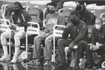  ?? ASSOCIATED PRESS ?? PHOENIX SUNS GUARD DEVIN BOOKER watches from the bench during the first half of a game against the Oklahoma City Thunder on Wednesday in Phoenix.