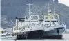  ?? PHOTO: GERARD O’BRIEN ?? Te Raukura (left) and Aleksey Slobodchik­ov berthed at the T/U sheds in Otago Harbour.