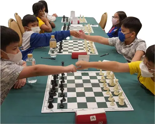  ?? PHOTOGRAPH COURTESY OF DPWH ?? SPED students from Tuguegarao North Central School enjoy chess matches during the 6th Eastern Asia Youth Chess Championsh­ips.