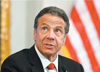  ?? PHOTO AFP ?? Le gouverneur de l’état de New York, Andrew Cuomo, en point de presse, hier, dans les locaux de la Bourse de New York, à l’occasion de la réouvertur­e du parquet.