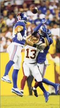  ?? Patrick Semansky / Associated Press ?? Washington Football Team wide receiver Adam Humphries (13) looses the ball as he is covered by New York Giants cornerback James Bradberry (24) and inside linebacker Blake Martinez (54) during Thursday’s game.