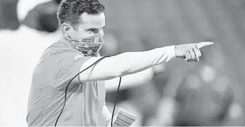  ?? JAMIE RHODES/COURTESY ?? Hurricanes coach Manny Diaz reacts after a touchdown during the second half of Saturday night’s game against the Louisville.