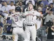  ?? Robert Gauthier Los Angeles Times ?? CARLOS CORREA (1) celebrates a game-tying homer by Marwin Gonzalez in ninth inning of Game 2.