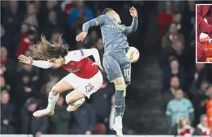  ??  ?? Aerial show: Arsenal’s Matteo Guendouzi (left) and Sporting’s Fredy Montero challengin­g for the ball during the Europa League Group E match at the Emirates on Thursday. Inset: Arsenal’s Danny Welbeck leaves the pitch on a stretcher after sustaining an injury. — AP / Reuters