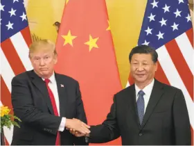  ?? Andrew Harnik / Associated Press 2017 ?? President Trump and Chinese President Xi Jinping meet in China in November. The White House says it is moving ahead with tariffs on Chinese goods.