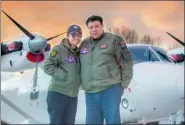  ?? PROVIDED TO CHINA DAILY ?? Zhang Xinyu and his wife, Liang Hong, with their twin-engine Y-12 plane before setting off on their trip.