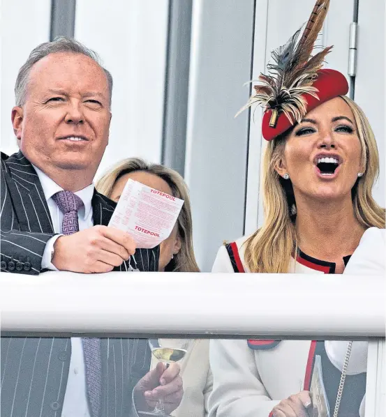  ?? ?? Peer and businesswo­man Michelle Mone joins her husband Doug Barrowman at Cheltenham Festival in 2019