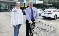  ??  ?? Taking action Labour councillor Fiona Dryburgh at Morrisons in Lindsayfie­ld with the supermarke­t manager Peter Kelly