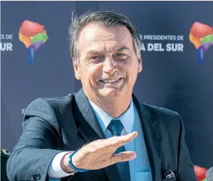  ?? MARTIN BERNETTI AFP/GETTY IMAGES ?? A poll published this week showed Brazilian President Jair Bolsonaro’s approval rating had dropped by 16 percentage points since January. The benchmark stock index and currency also fell Friday.