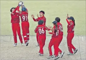  ?? GETTY IMAGES ?? China women players celebrate the fall of a wicket in the 2014 Asian Games in Incheon.