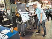  ?? MATT ROURKE/AP 2019 ?? Steve Marcinkus of the Office of the City Commission­ers shows the ExpressVot­e XL voting machine in Philadelph­ia.