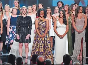  ?? PHIL MCCARTEN/INVISION/AP PHOTO ?? Former gymnast Sarah Klein, former Michigan State softball player Tiffany Thomas Lopez and gymnast Aly Raisman, from left in front, and others who suffered sexual abuse accept the Arthur Ashe award for courage at the ESPY Awards on Wednesday.