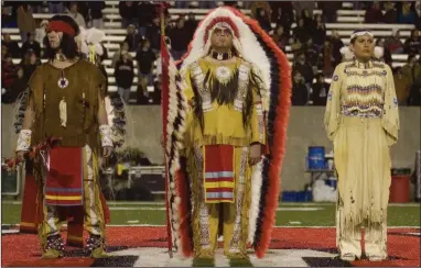  ?? (Democrat-Gazette file photo) ?? The Arkansas State “Indian Family” is honored during a ceremony at halftime of ASU’s football game against North Texas in Jonesboro on Nov. 15, 2007. It was ASU’s final football game using Indians as its mascot.