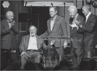  ?? Yi-Chin Lee / Staff photograph­er ?? All five living former presidents came together for a benefit concert after Hurricane Harvey. From left are Jimmy Carter, George H.W. Bush, George W. Bush, Bill Clinton and Barack Obama.