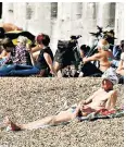  ??  ?? Sunbathing in Portsmouth: temperatur­es are likely to reach 63F by Tuesday