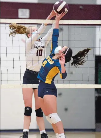  ?? SARAH GORDON/THE DAY ?? East Lyme’s Ella Freed (10) goes up to block a return by Ledyard’s Hannah Avila (8) at the net during the Vikings’ 3-1 win over the Colonels in Thursday’s ECC Region I volleyball postseason experience final.