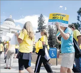  ?? Rich Pedroncell­i
Associated Press ?? SUPPORTERS of the California measure to allow the terminally ill to end their own lives march in September. The governor signed the measure Monday.