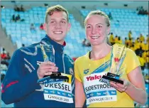  ?? LEE JIN-MAN/AP PHOTO ?? Caeleb Dressel of the United States, left, and Sweden’s Sarah Sjsotrom pose with their trophies for top male and female swimmers on Sunday at the World Swimming Championsh­ips in Gwangju, South Korea.