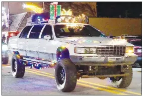  ?? (NWA Democrat-Gazette/Randy Moll) ?? Among the cars on Main Street was this off-roading-in-style Cadillac.