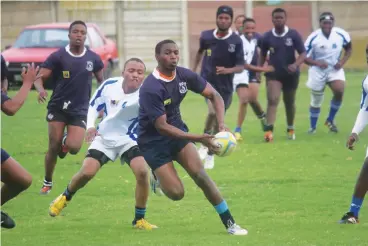  ?? Photo: Daniel Goldberg ?? Old Collegians (white) beat Lily White 23-20 in their SEDRU Heritage Day rugby match.