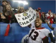  ?? CURTIS COMPTON — ASSOCIATED PRESS ?? Georgia defensive end Jonathan Ledbetter celebrates his team’s 34-17 victory over Kentucky Nov. 3 in Lexington, Ky.