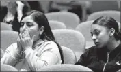  ??  ?? JAYLENE REA, left, reacts as the panel is told of alleged harassment by deputies aimed at her family.