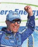  ?? MIKE DINOVO/USA TODAY SPORTS ?? Kevin Harvick celebrates winning the Consumers Energy 400 on Sunday.