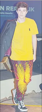  ?? ?? This look incorporat­ed casual and a formal look with red, yellow and lime African printed pants, yellow T-shirt and black blazer.