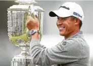  ?? Scott Strazzante / San Francisco Chronicle ?? Collin Morikawa holds the Wanamaker Trophy after finishing 13-under at the PGA Championsh­ip.