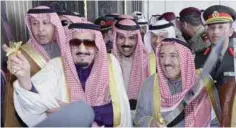  ??  ?? His Highness the Amir Sheikh Sabah Al-Ahmad Al-Jaber Al-Sabah and Saudi King Salman Bin Abdulaziz Al Saud perform the traditiona­l ‘ardha’ dance, as His Highness the Crown Prince Sheikh Nawaf Al-Ahmad Al-Jaber AlSabah is seen in the background.