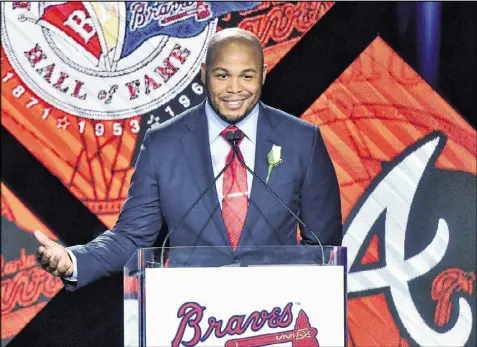  ?? HYOSUB SHIN / HSHIN@AJC.COM ?? Former Atlanta Braves center fielder Andruw Jones speaks Friday after being inducted into the Braves Hall of Fame during a luncheon at the Hyatt Regency.