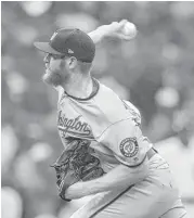  ?? John McDonnell / Washington Post ?? Stephen Strasburg shakes off an illness to pitch seven shutout innings, striking out 12, to lift the Nationals over the Cubs and force a decisive Game 5.