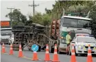  ?? PHOTO: TERESA RAMSEY/FAIRFAX NZ ?? A logging truck lost its load.