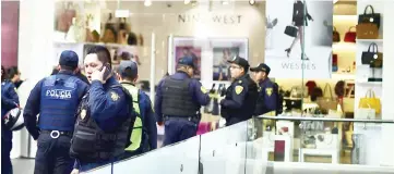  ??  ?? Police are seen at a mall in Mexico City, after a shootout in which at least one person was injured. — AFP photo