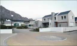  ??  ?? SECURE ESTATE: The first homes are taking shape at Brandwacht aan Rivier on the R44 outside Stellenbos­ch. The developmen­t has 24-hour manned security and an electric fence.