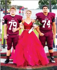  ?? Westside Eagle Observer/RANDY MOLL ?? Senior maid Courtney McCollum is escorted by juniors Ross Wilmoth and Kerlose Ruzek at homecoming ceremonies at Gentry High School.