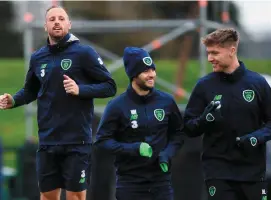  ??  ?? David Meyler (left) warms up during training in Abbotstown alongside Wes Hoolahan and Jeff Hendrick