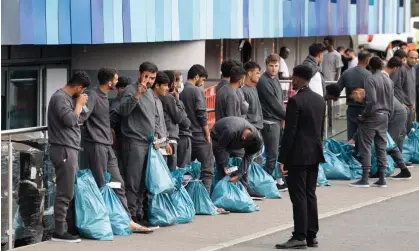  ?? ?? Asylum seekers in Feltham, London. ‘Labour’s commitment to recruit 1,000 new staff to process applicatio­ns is a solid one.’ Photograph: Shuttersto­ck