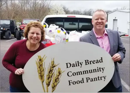  ?? SUBMITTED PHOTO ?? Grace Gordan from the Daily Bread food pantry and Rotarian Joe Groarke. With so many people struggling during the coronaviru­s pandemic, the food pantry is in desperate need of donations.