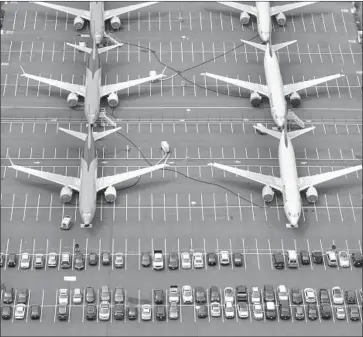  ?? Stephen Brashear Getty Images ?? BOEING delivered 90 aircraft in the second quarter. Above, 737 Max jetliners near Boeing Field in Seattle.