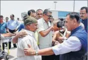  ??  ?? Gujarat chief minister Vijay Rupani meeting pilgrims injured in the terror attack in Jammu and Kashmir after they were brought to the Surat airport in an IAF plane on Tuesday.