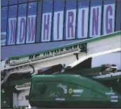  ?? NAM Y. HUH/AP ?? A HIRING SIGN IS DISPLAYED at a furniture store window on Friday, Sept. 17, in Downers Grove, Ill.