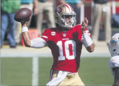  ??  ?? NHAT V. MEYER — BAY AREA NEWS GROUP San Francisco 49ers starting quarterbac­k Jimmy Garoppolo (10) throws against the Miami Dolphins in the first quarter at Levi’s Stadium in Santa Clara on Sunday, Oct. 10.