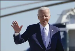  ?? SUSAN WALSH — THE ASSOCIATED PRESS ?? President Joe Biden waves to the media as he walks to board Air Force One at Andrews Air Force Base, Md., on Saturday.