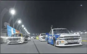  ?? CHRIS GRAYTHEN / GETTY IMAGES ?? Truck series driver Johnny Sauter will bring his No. 21 Chevrolet (right) to Saturday’s Active Pest Control 200 at Atlanta Motor Speedway.