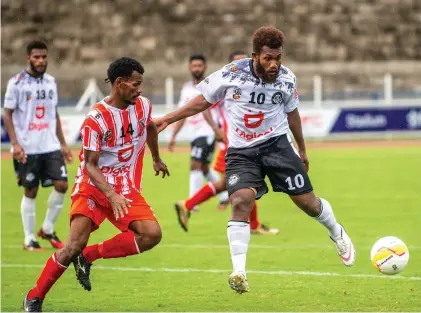  ?? Photo: Leon Lord ?? Suva striker Marlon Tahioa (right) controls the ball from Labasa defender Akeimi Ralulu during the third round of the Digicel Fiji Premier League at the HFC Bank Stadium, Suva on March 5, 2023.