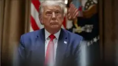  ?? Alex Brandon/Associated Press ?? President Donald Trump listens during a meeting with U.S. tech workers before signing an executive order at the White House on Monday.